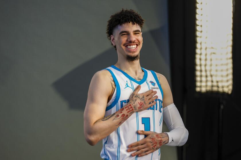 Charlotte Hornets guard LaMelo Ball laughs at the NBA basketball's team media day in Charlotte, N.C., Monday, Oct. 2, 2023. (AP Photo/Nell Redmond)