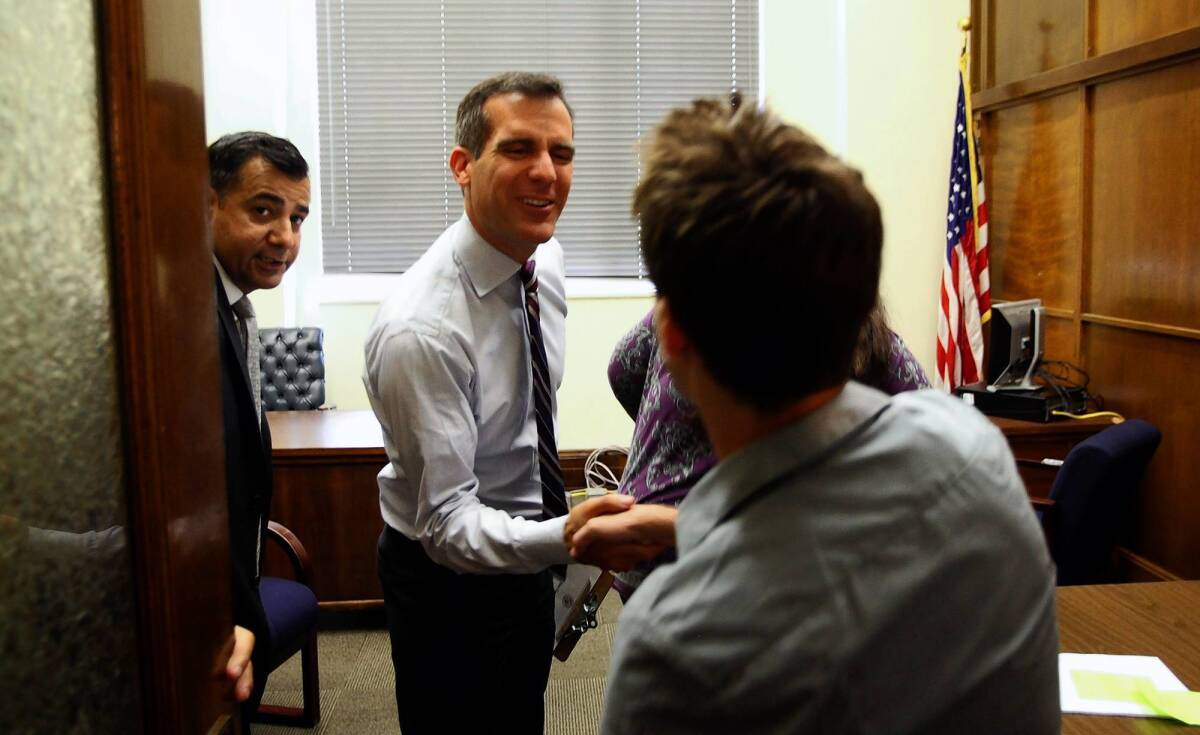 On his first day on the job, Los Angeles Mayor Eric Garcetti meets with Hollywood resident Michael Konowitz in his office at City Hall. Konowitz spoke out against the city’s recent crackdown on Lyft, a ride-sharing service opposed by cab companies. "It was amazing," he said. "I wasn't actually expecting to meet with the mayor himself. I was expecting to get a staff member."