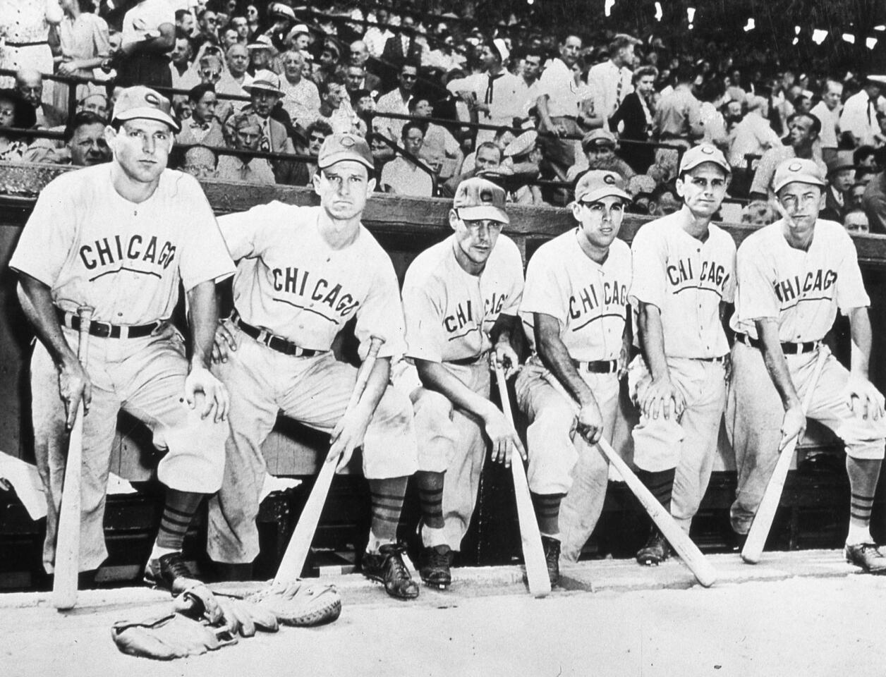 A group of Chicago Cubs pose in their dugout in Wrigley Field on Oct. 6, 1945, before the start of game 4 of the 1945 World Series. These Cubs are, from to right, Swish Nicholson, Andy Pafko, Phil Cavaretta, Peanuts Lowrey, Don Johnson, and Stan Hack.