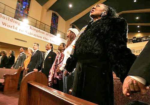SHOW OF UNITY: People join hands during a memorial service at First African Methodist Episcopal Church in Los Angeles after this weeks death of Coretta Scott King at age 78. "I feel like it is the other half of Martin Luther King that is gone," Diskin Bailey, a 40-year-old Navy veteran, said at the King Center in Atlanta.
