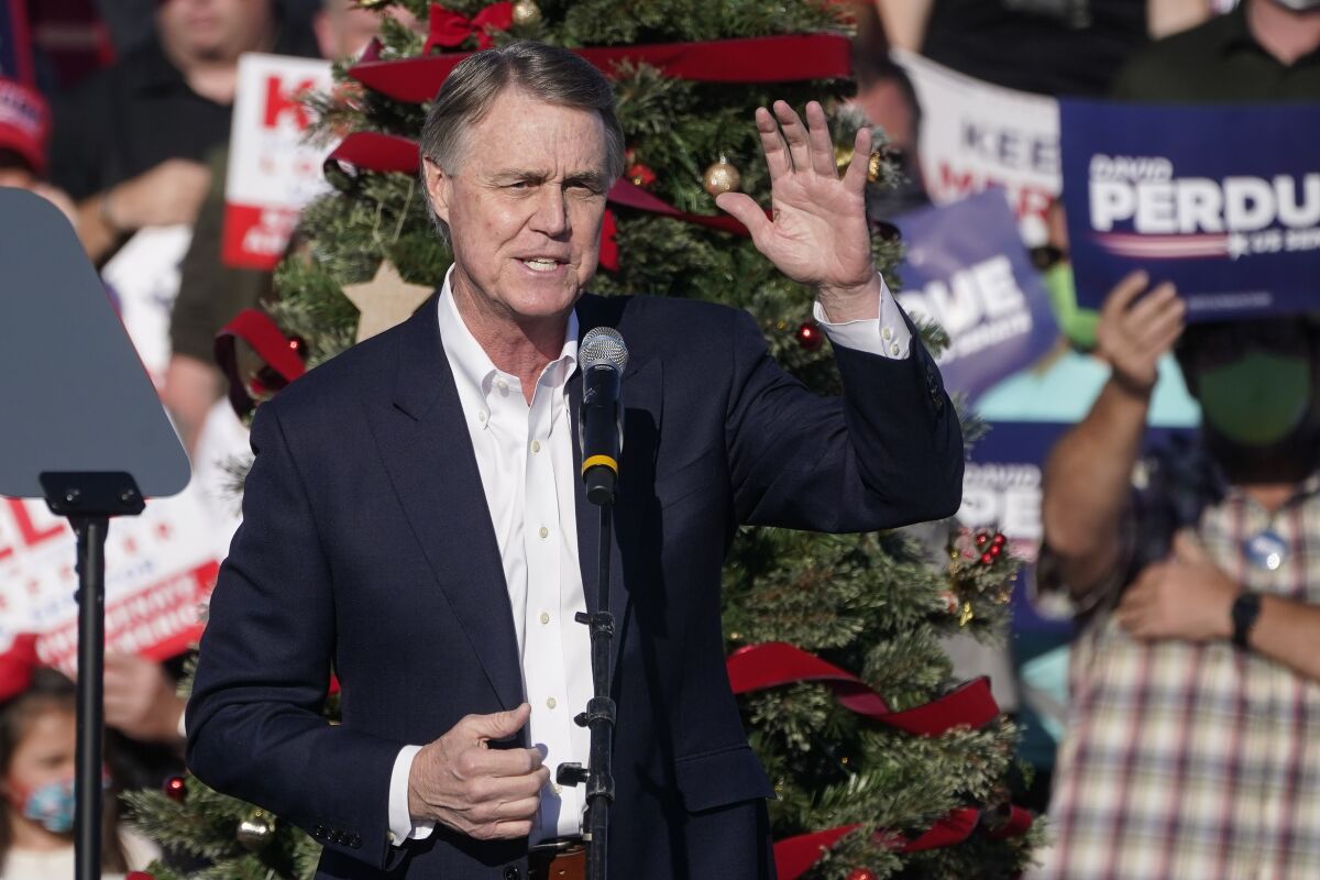 FILE - Sen. David Perdue, R-Ga., speaks during a rally in Augusta, Ga., on Dec. 10, 2020. Georgia Gov. Brian Kemp, who drew Donald Trump's wrath for refusing to act on his false allegations of a stolen election, is likely to face the former senator for the 2022 Republican primary for governor. (AP Photo/John Bazemore, File)