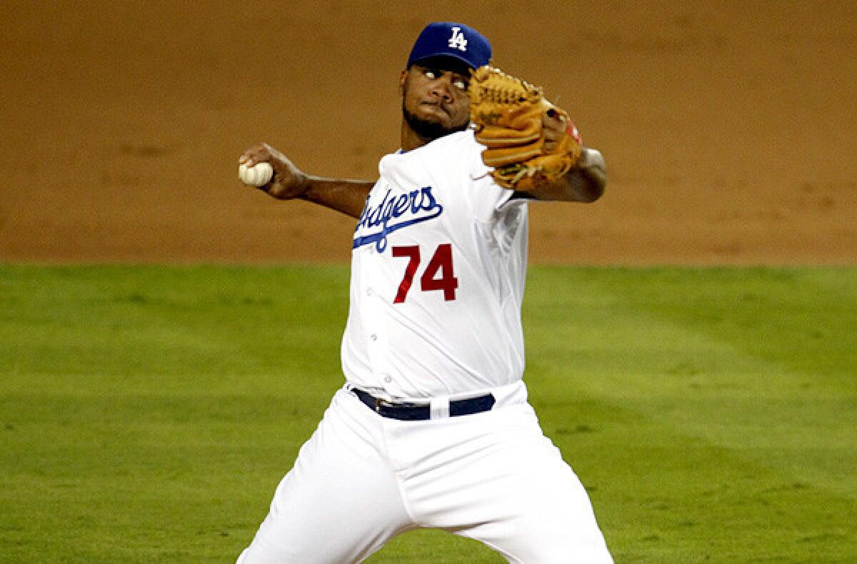 Dodgers closer Kenley Jansen had a 4-3 record last season with 28 saves and 1.88 earned-run average. Above, Jansen pitches in the ninth inning against the St. Louis Cardinals in game 3 of the NLCS, which the Dodgers won 3-0.