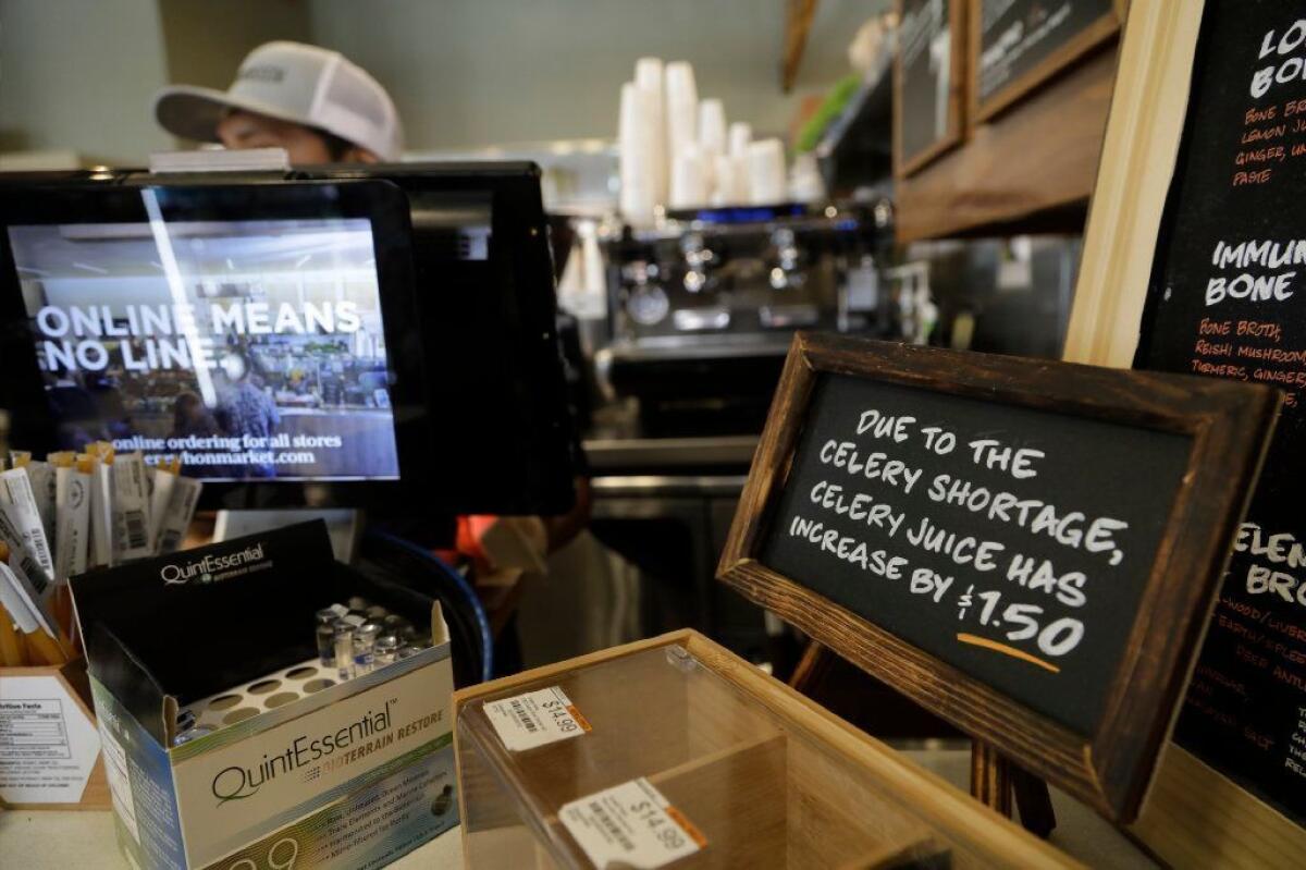 A notice by the register notifies customers of a shortage in celery and subsequent price increase at Erewhon Market in Los Angeles.