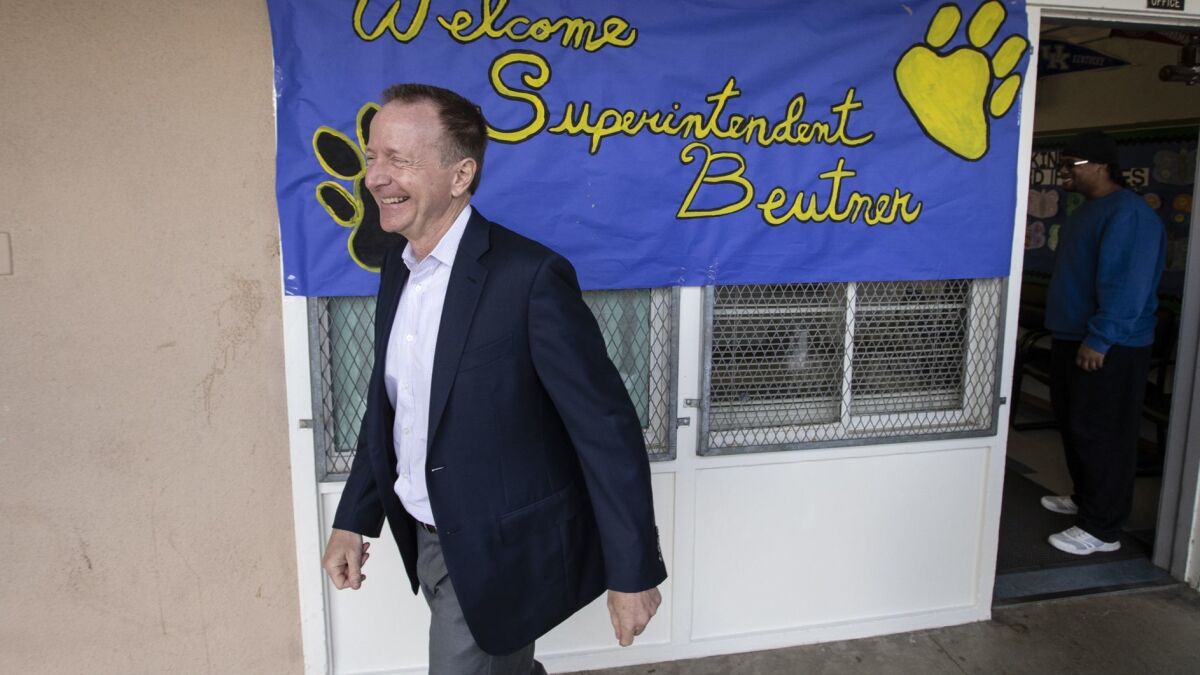 L.A. schools Supt. Austin Beutner, shown here during a school visit, is developing a plan to shrink the central office with help from consultants.