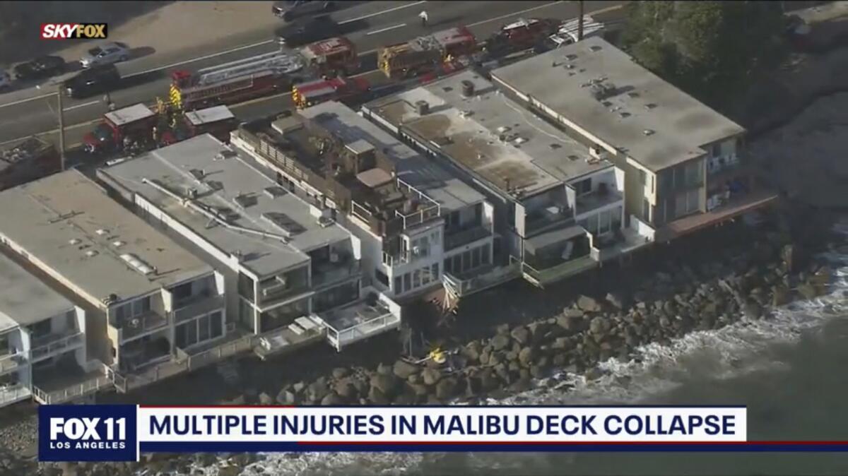 In this Saturday, May 8, 2021 aerial screenshot released by FOX 11 KTTV shows Los Angeles County firemen at the scene of a collapsed balcony incident in Malibu, Calif. The Los Angeles County Fire Department says many as 15 people were on the balcony overlooking the Pacific Saturday evening when it collapsed and crashed up to 15 feet to rocks below. (Fox 11 KTTV via AP)
