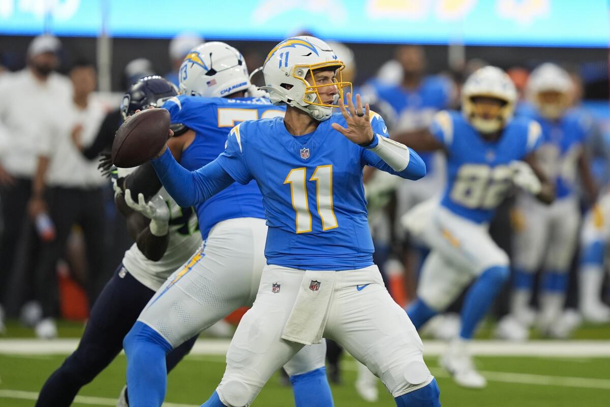 Chargers quarterback Luis Perez (11) passes against the Seattle Seahawks in their preseason game.