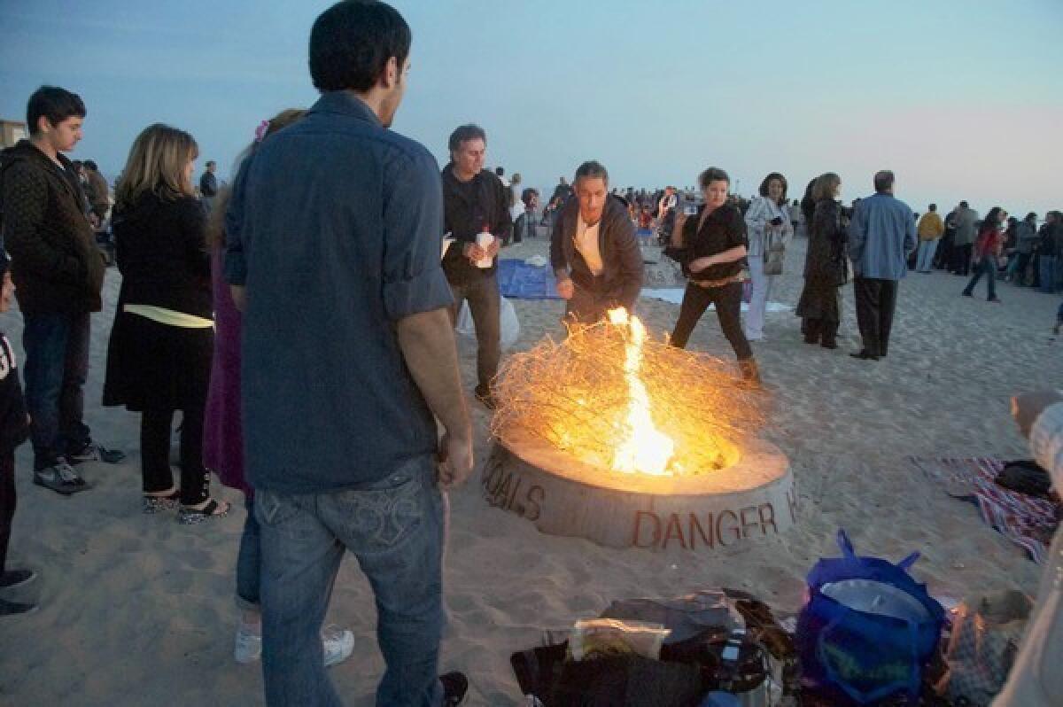 Fire pits like this one in Newport Beach face a ban for air quality reasons.