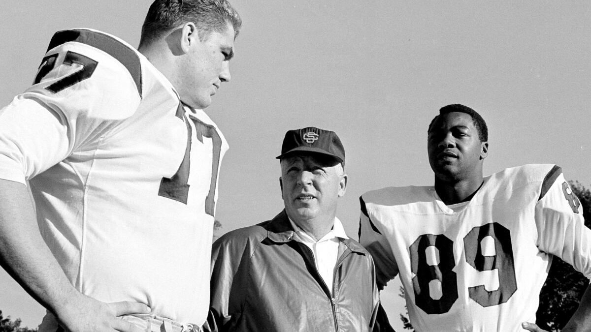 USC Coach John McKay with All-Americans Ron Yary, left, and Nate Shaw before a practice on Dec. 13, 1966.