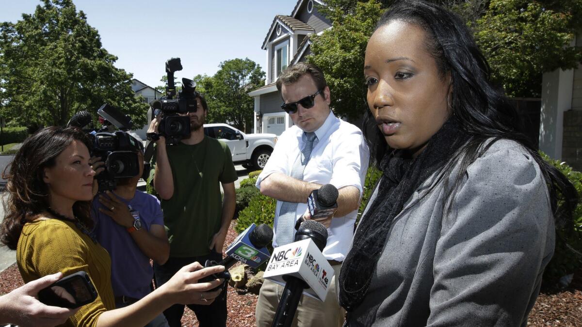 Ina Rogers speaks with reporters on Monday. She denies mistreating her children.