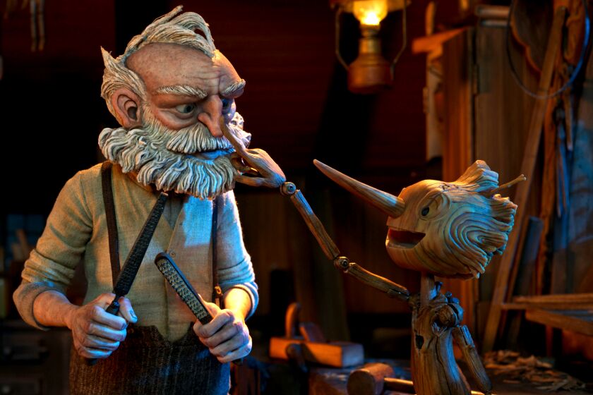 Guillermo del Toro's Pinocchio - (L-R) Gepetto (voiced by David Bradley) and Pinocchio (voiced by Gregory Mann). 