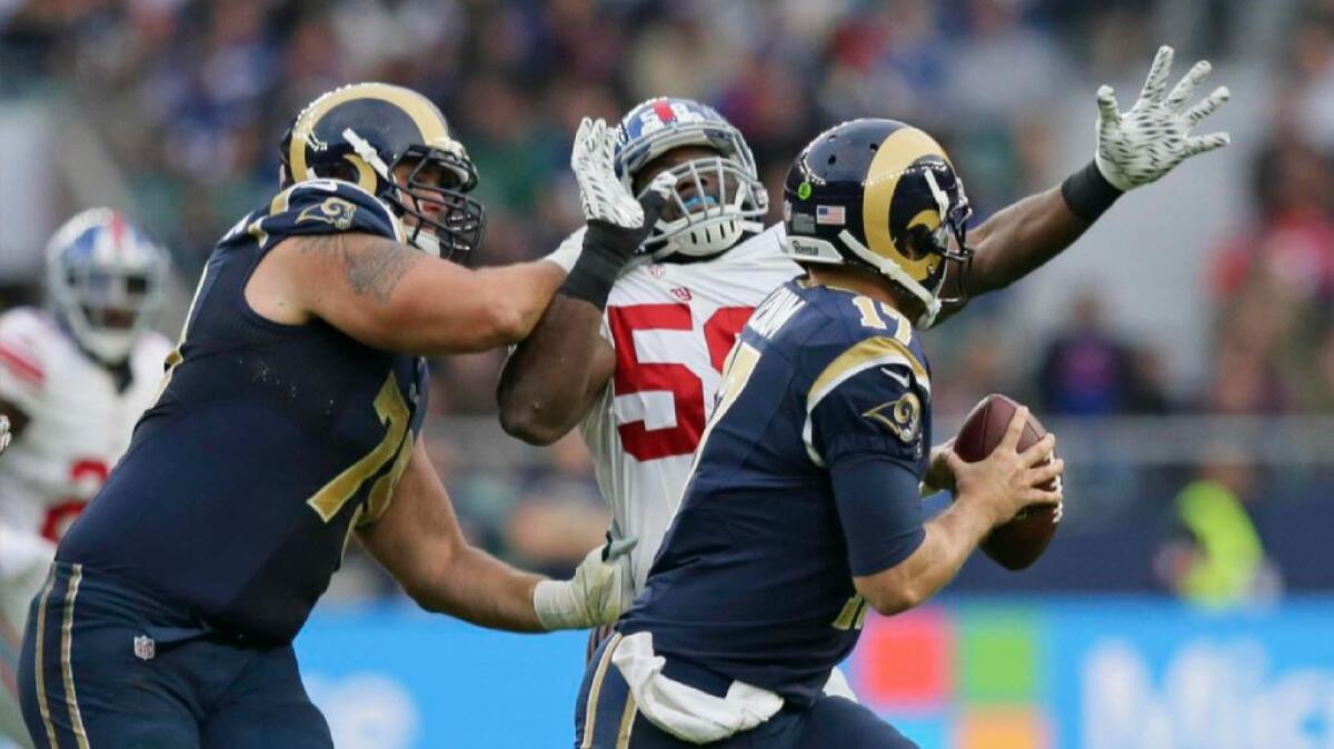 Giants defensive end Owa Odighizuwa is blocked as he tries to get to Rams quarterback Case Keenum during a game in London on Oct. 23.