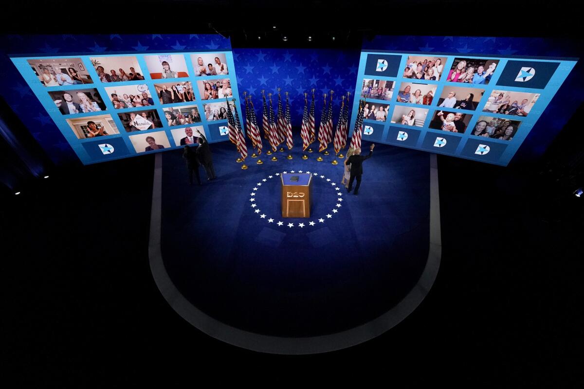 Joe Biden, Jill Biden, Kamala Harris, and Doug Emhoff wave to supporters online at the Democratic National Convention.