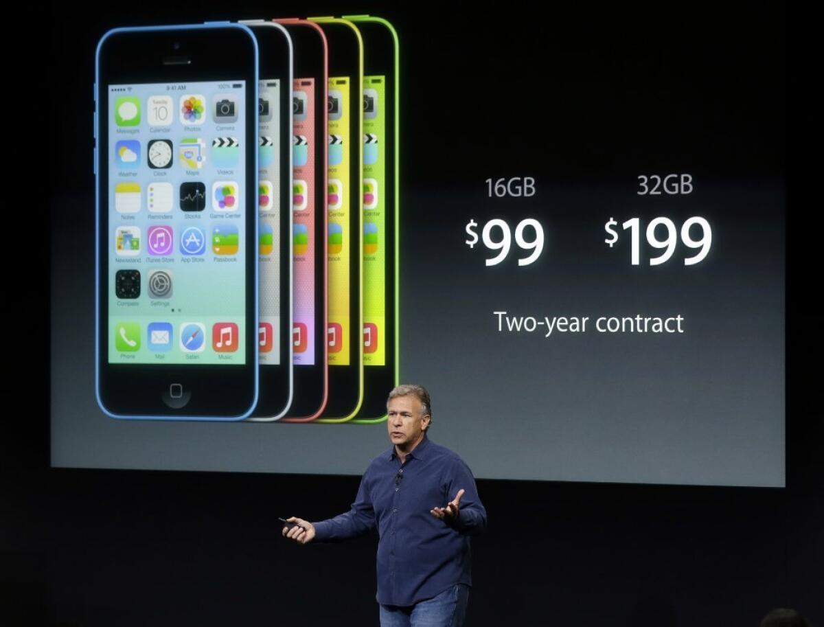 Phil Schiller, Apple's senior vice president of worldwide product marketing, speaks on stage during the introduction of the new iPhone 5c in Cupertino, Calif., on Tuesday.