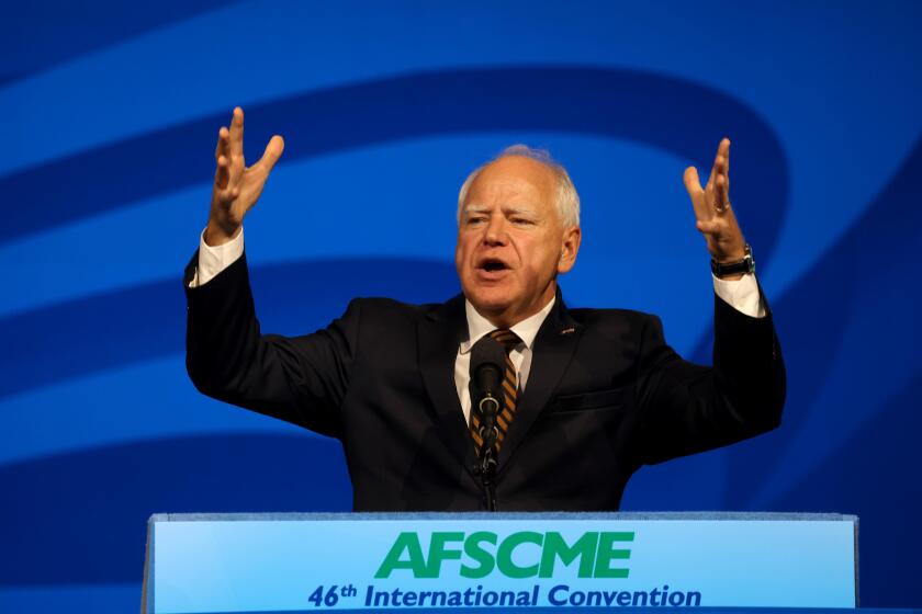 LOS ANGELES, CA - AUGUST 13, 2024 - Governor Tim Walz, vice presidential nominee, delivers remarks at the AFSCME's 46th International Convention in Los Angeles on August 13, 2024. Walz was joined by AFSCME President Lee Saunders and public service workers from all over the U.S. (Genaro Molina/Los Angeles Times)