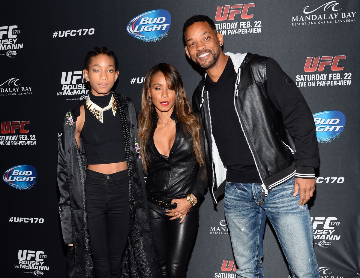 Willow Smith, left, with parents Jada Pinkett Smith and Will Smith.