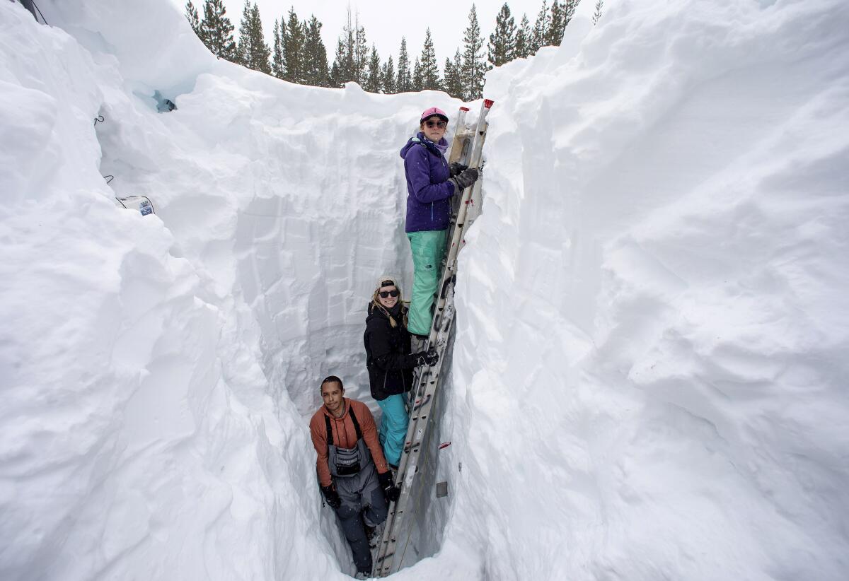 Scientists work in a snow pit in Soda Spring, Calif. 