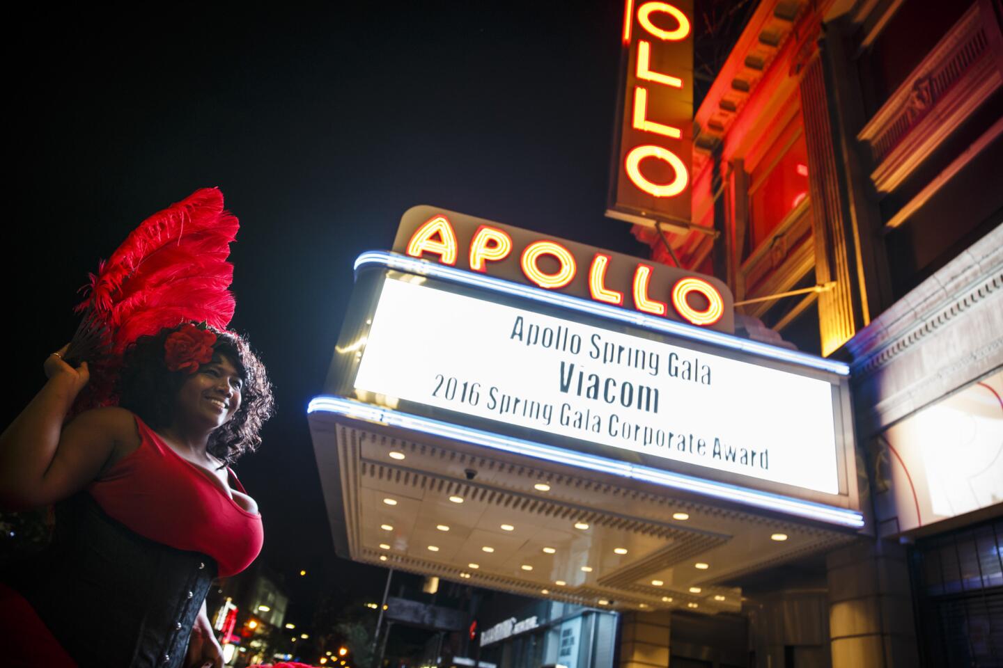 Amanda Humes pauses outside the famed Apollo Theater in Harlem.