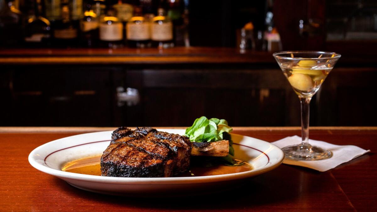 A bone-in rib-eye steak with a martini at Musso and Frank Grill