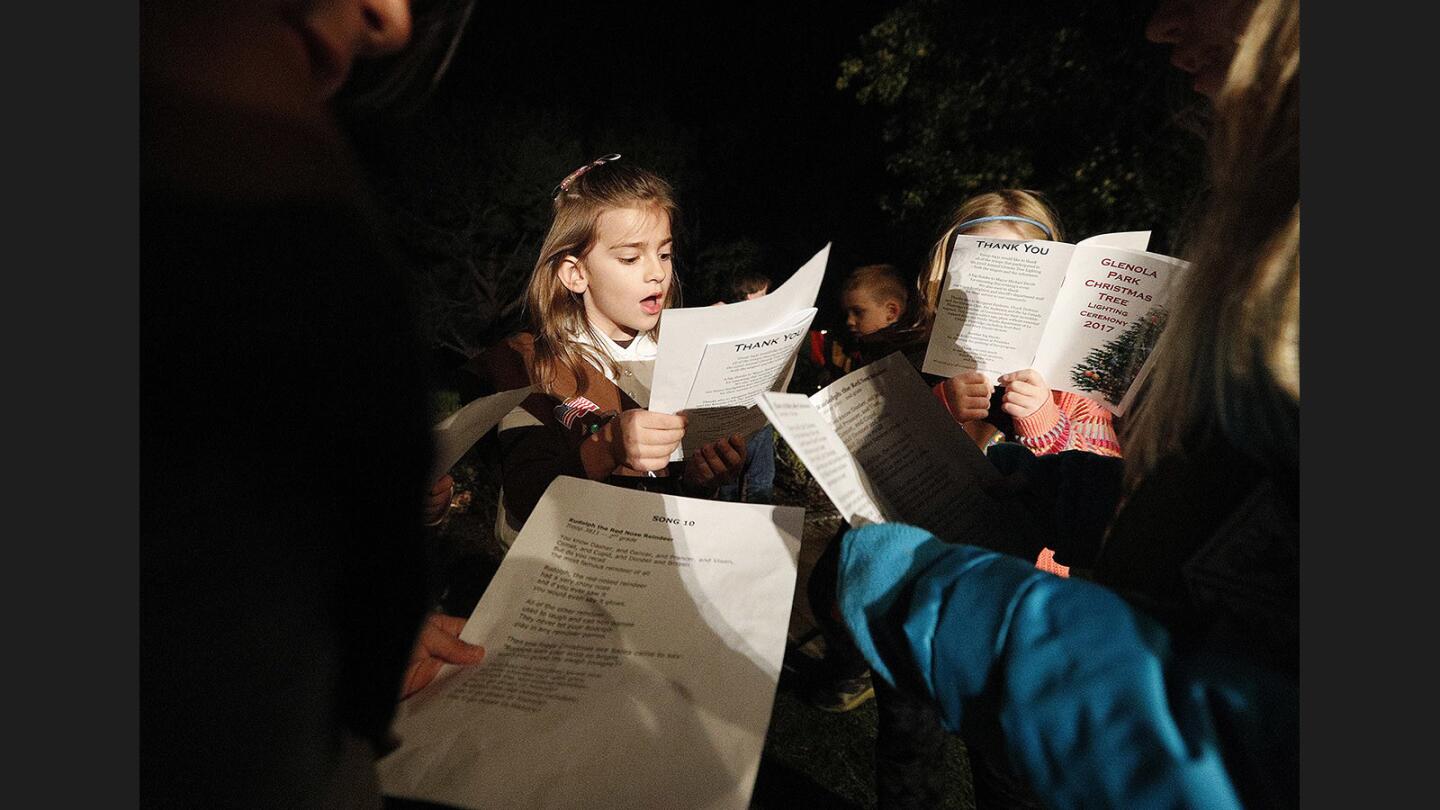 Immie Eichen, 7, with fellow girls in Troop 3811, rehearses Rudolph the Red Nosed Reindeer before they performed in front of an audience at Glenola Park Christmas Tree lighting ceremony for 2017 on Wednesday, December 6, 2017. Several Girl Scout troops sang Christmas songs, introduced by La Canada Flintridge Mayor Mike Davitt.
