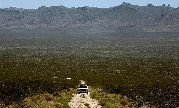 National Park Service Ranger Tim Duncan patrols the vast Mojave National Preserve near Kelso, Calif. The preserve, a sweep of serrated mountains, feral deserts, Joshua tree forests, dry lakes and lava beds, is five times the size of Los Angeles and is patrolled by eight law officers
