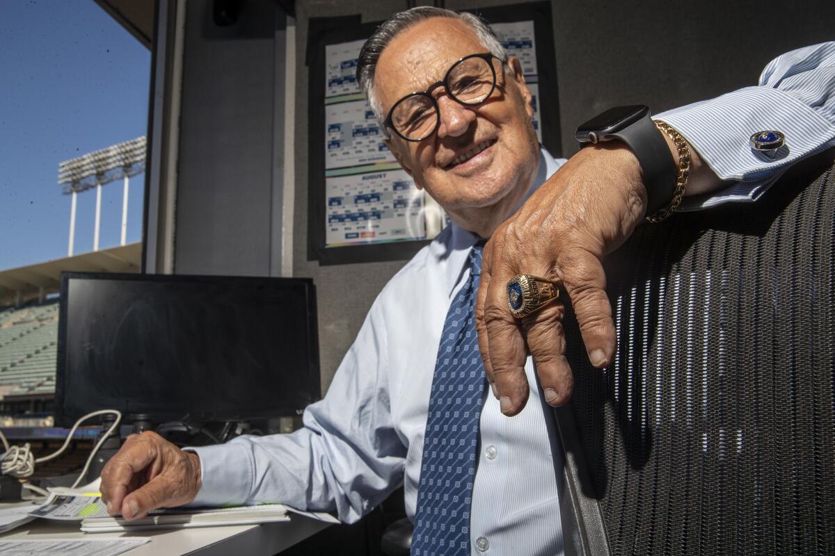 Legendary Dodgers Spanish broadcaster Jaime Jarrín smiles from the booth at Dodger Stadium.