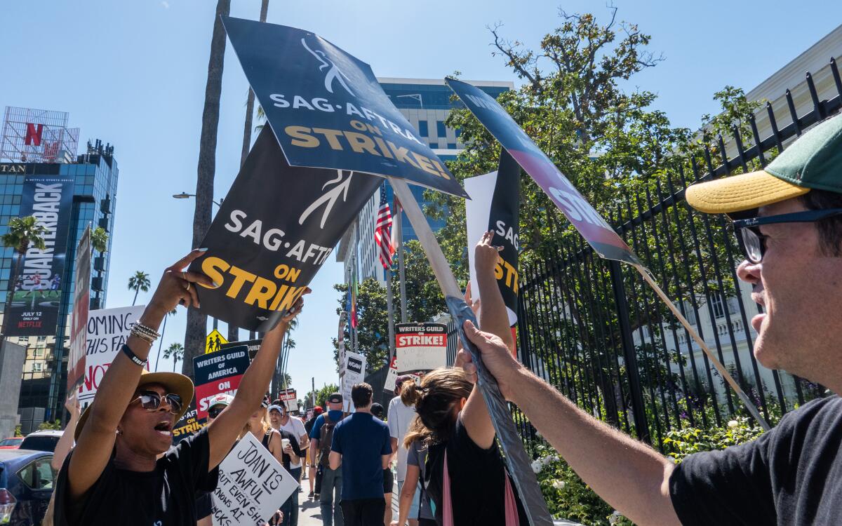 SAG-AFTRA protest signs 2023 vs 2024 settlement The Future of the Creative Zeitgeist