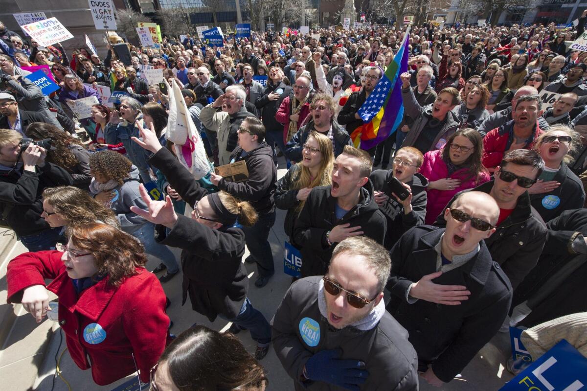Thousands of opponents of Indiana Senate Bill 101, the Religious Freedom Restoration Act, protest on the lawn of the Indiana State House on Saturday.