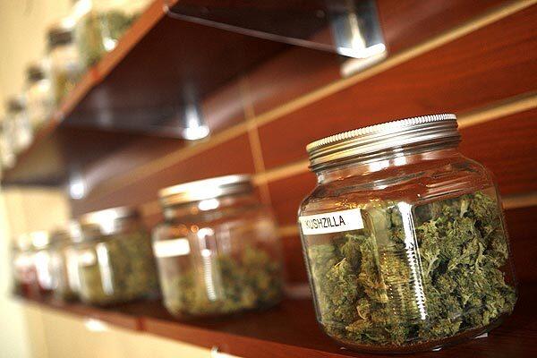 Different strains of medical marijuana sit on a shelf inside Green Oasis, a medical mariujuana dispensary in Playa Vista. A Superior Court judge decided that the city of Los Angeles' moratorium on new medical marijuana dispensaries is invalid and granted a preliminary injunction against enforcement of the ban sought by Green Oasis, which had sued the city.