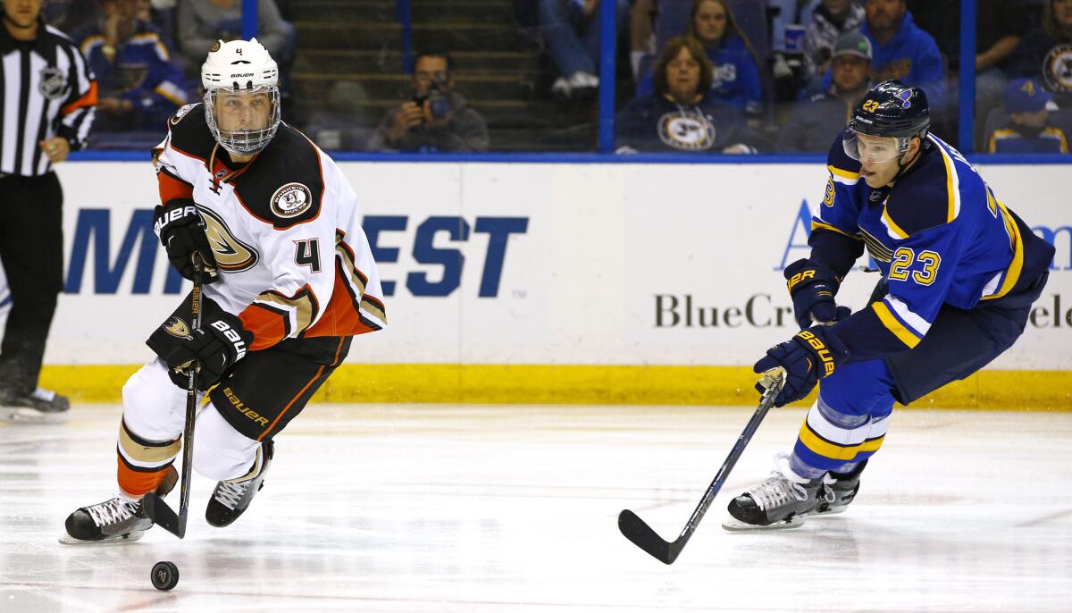 Ducks forward Cam Fowler skates the puck out of his own zone as St. Louis forward Dmitrij Jaskin applies pressure during the first period of a game on March 11.