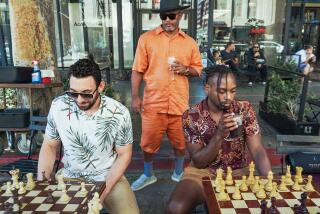 Participants play chess at DTLA Chess located at ilCaffe 855 S Broadway, Los Angeles.