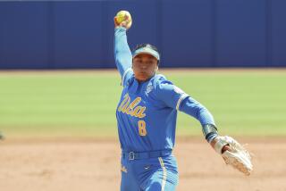 FILE - UCLA's Megan Faraimo pitches in the first inning of an NCAA softball Women's College World Series.