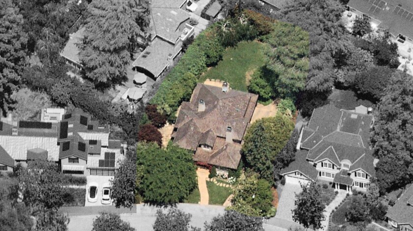 The traditional-style two-story home sits on about a quarter of an acre.