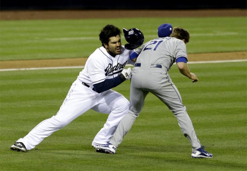 San Diego Padres outfielder Carlos Quentin charges into Dodgers pitcher Zack Greinke after being hit by a pitch.