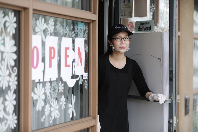 LOS ANGELES, CA - APRIL 08: Yoonjin Hwang, owner of Spoon by H, has been offering takeout food only during the coronavirus crisis. She said business has been terrible during the quarantine. (Myung J. Chun / Los Angeles Times)
