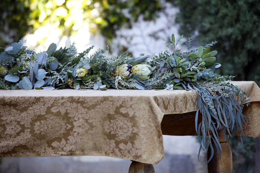 Floral designer Lori Eschler Frystak of Blossom Alliance foraged in her own Los Angeles backyard, as well as those of her neighbors, to create an elegant garland for the holidays.