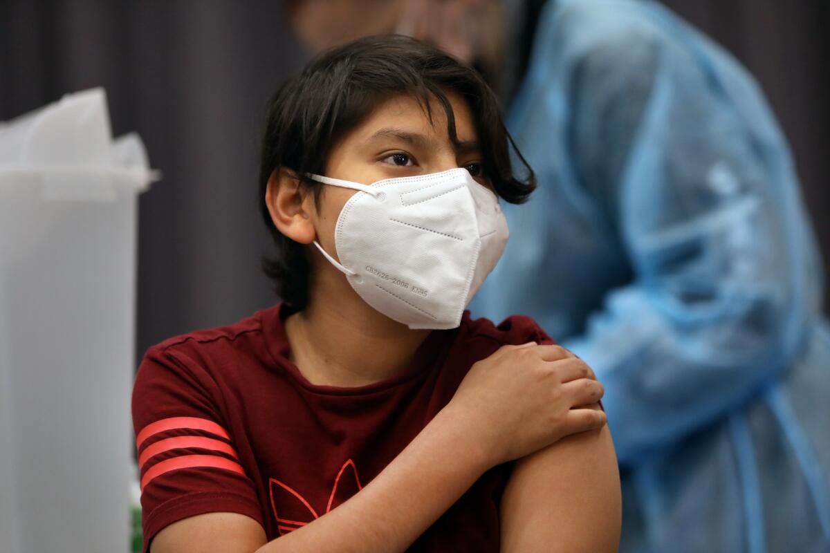 Max Hernandez gets vaccinated at San Pedro High School.