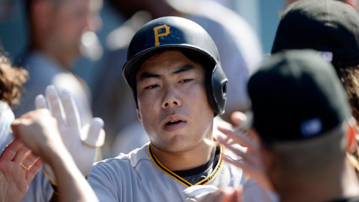 Pirates third baseman Jung Ho Kang is congratulated by his teammates after hitting a one-run home run against the Dodgers on Aug. 13.