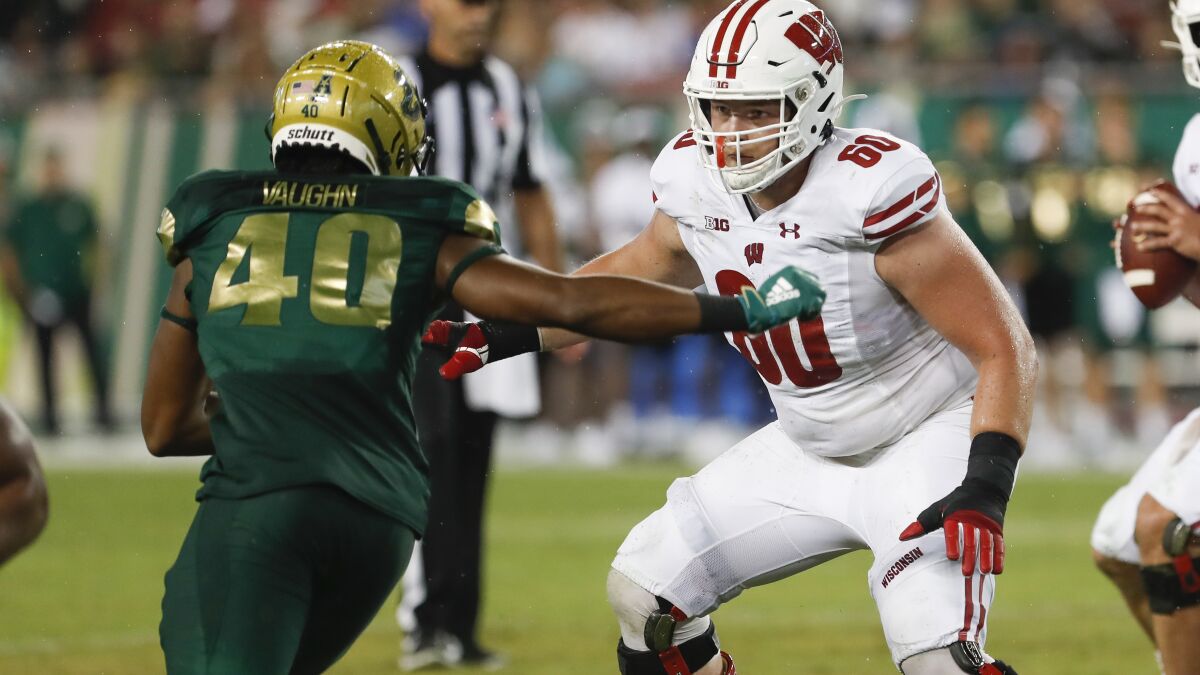 Champion Rams finally start draft with Wisconsin OL Bruss - The San Diego  Union-Tribune