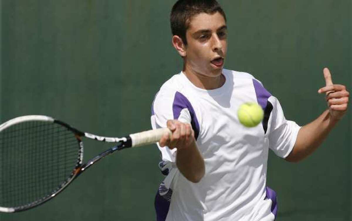 Hoover's Emile Ohanyan returns with a forehand shot in a Pacific League boys singles tennis prelims match at Pasadena High School on Monday, April 29, 2013.