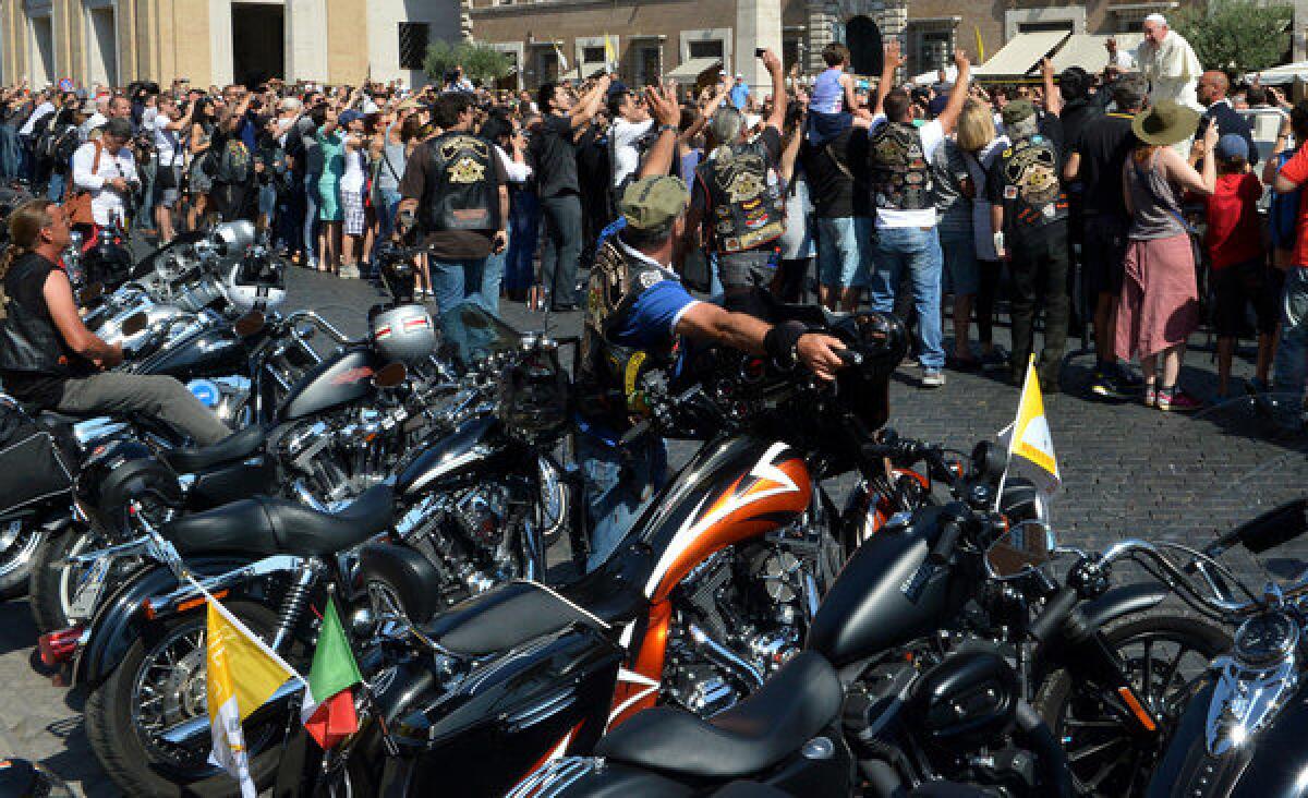 Pope Francis (at top right) blesses Harley-Davidson bikers on Sunday before a Mass at the Vatican. Harley-Davidson riders arrived in Rome to celebrate the motorcycle brand's 110th anniversary.