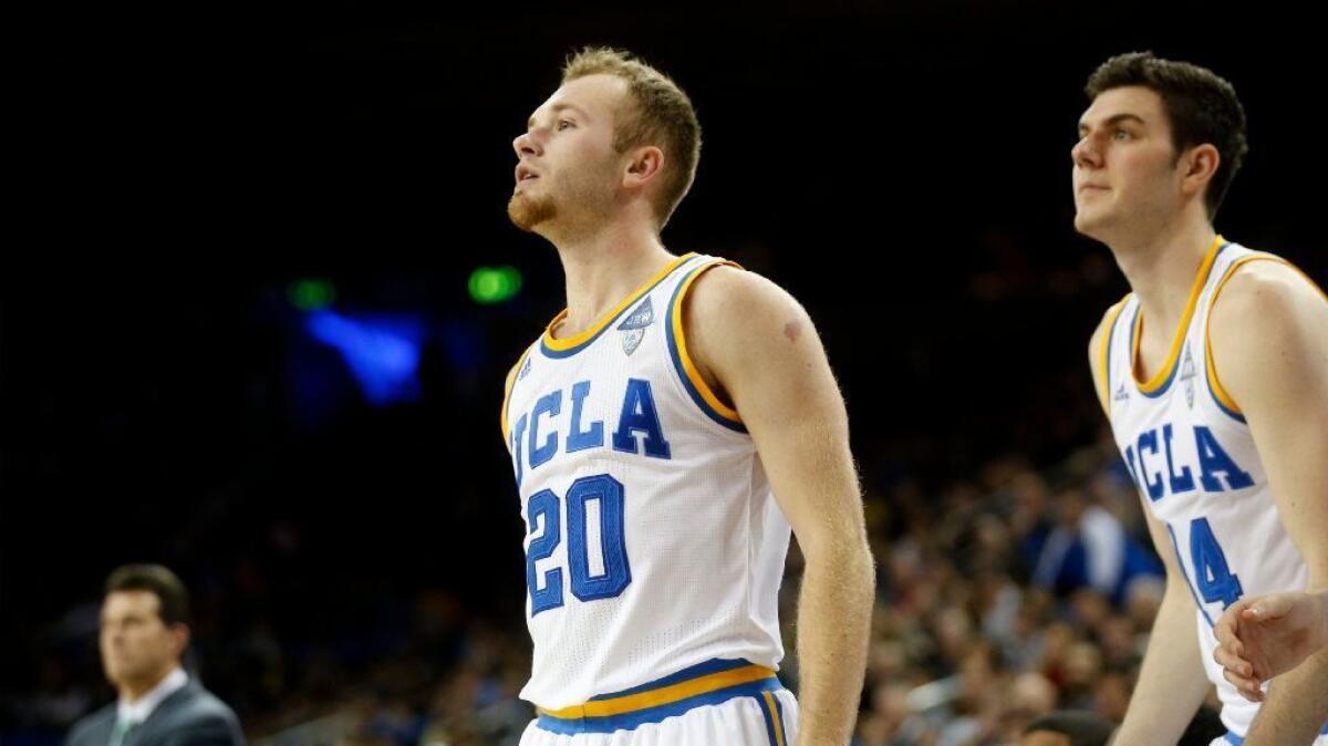UCLA guard Bryce Alford (20) and forward Gyorgy Goloman (14) look on during a game against Western Michigan on Dec. 21.