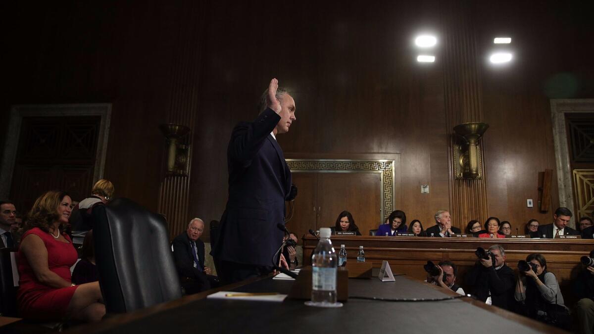 Ryan Zinke is sworn in Tuesday during his confirmation hearing.