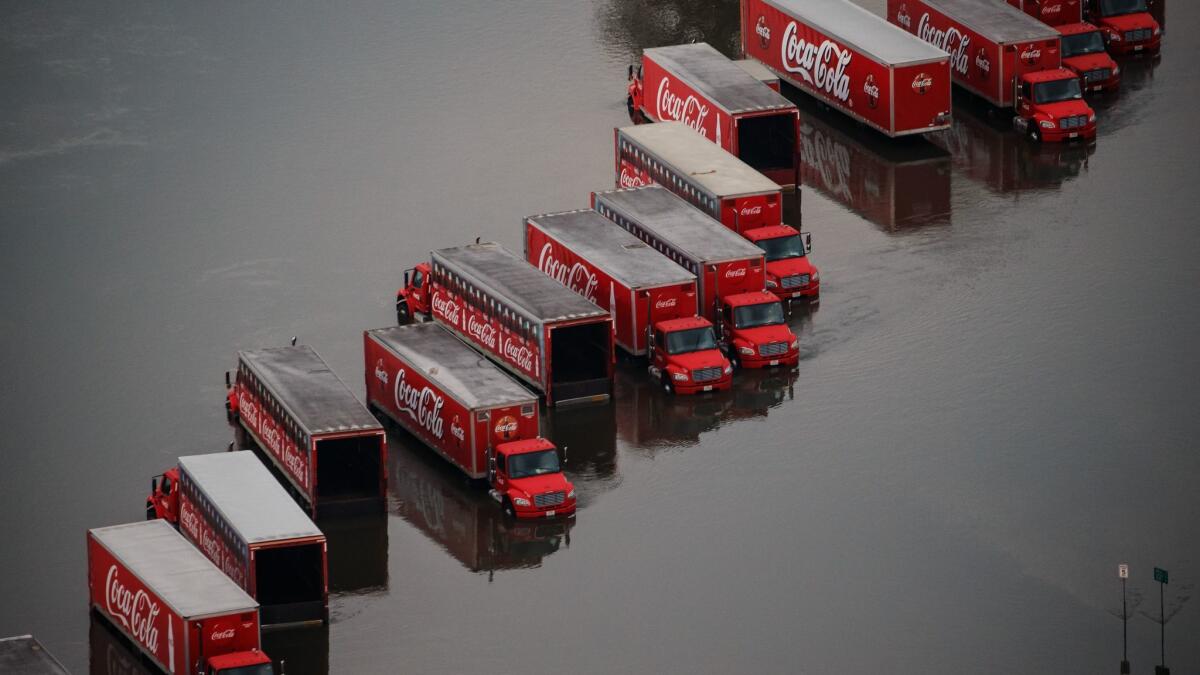 Delivery trucks are surrounded by floodwater in Lumberton, Texas, in the aftermath of Hurricane Harvey.