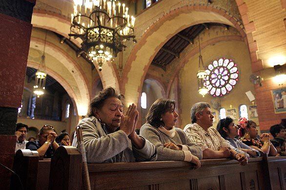 Parishioners of St. Cecilia Catholic Church attend a monthly mass in honor of the Virgin of Soledad, the patron saint of the Mexican state of Oaxaca. Latino immigrants have made the South Los Angeles church a home for the saints they worshiped in their native lands.
