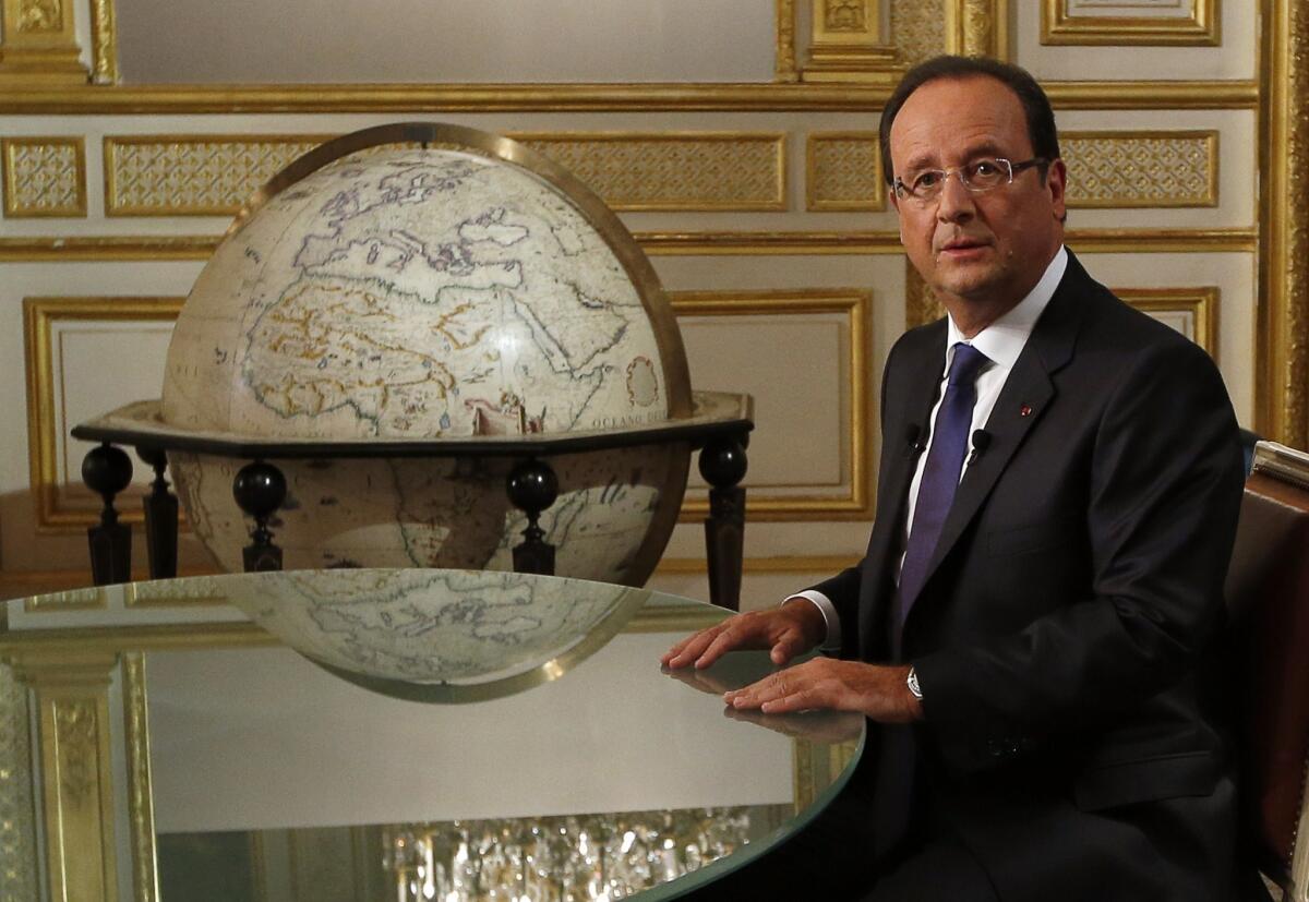 French President Francois Hollande, at the Elysee presidential palace in Paris, discussed the Syria chemical weapons deal in an interview with French television channel TF1.