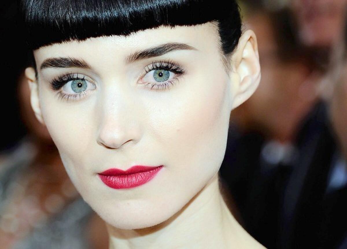 Rooney Mara sports dramatic eyes and lips at the Oscars ceremony.