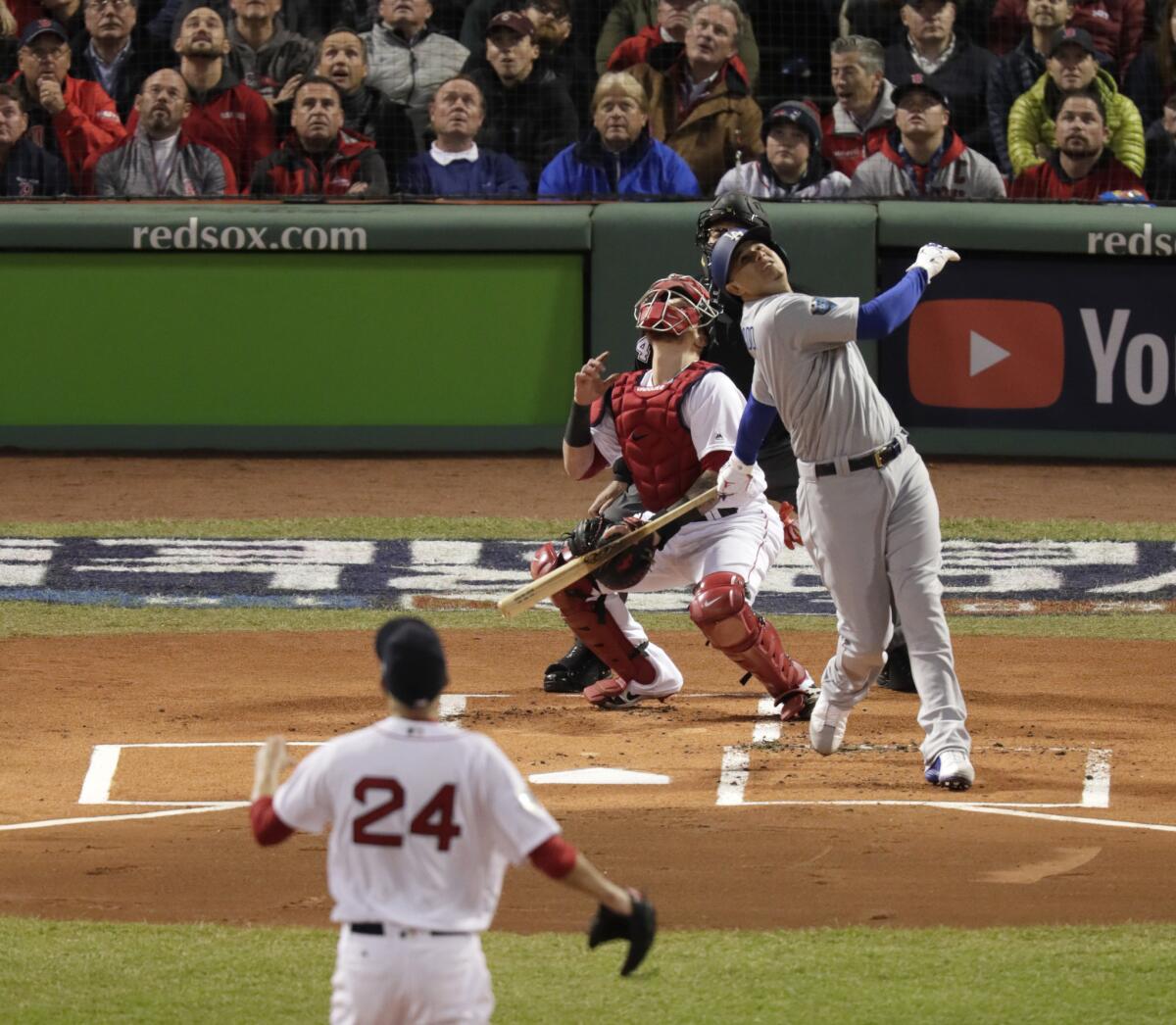 Dodgers' Manny Machado pops up in the first inning.