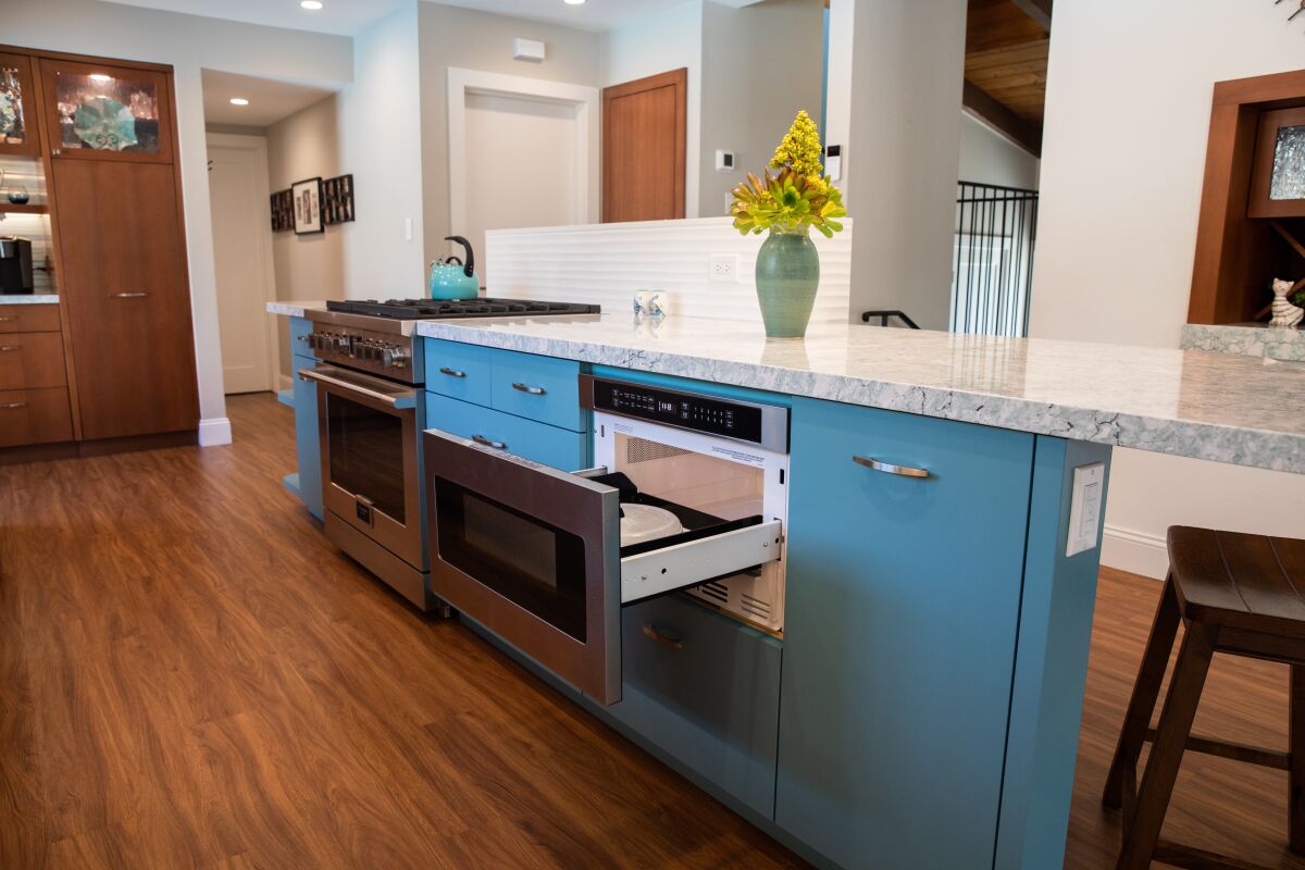 A remodeled kitchen, showing the center island with appliances.