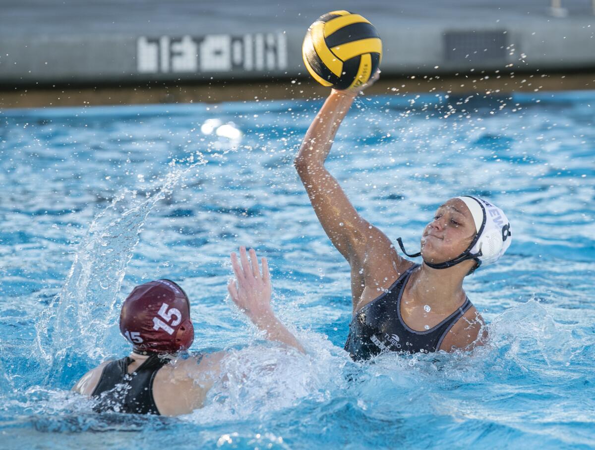 Newport Harbor's Chiara Amoroso takes a shot against Laguna Beach's Kara Carver during Tuesday's Surf League match.