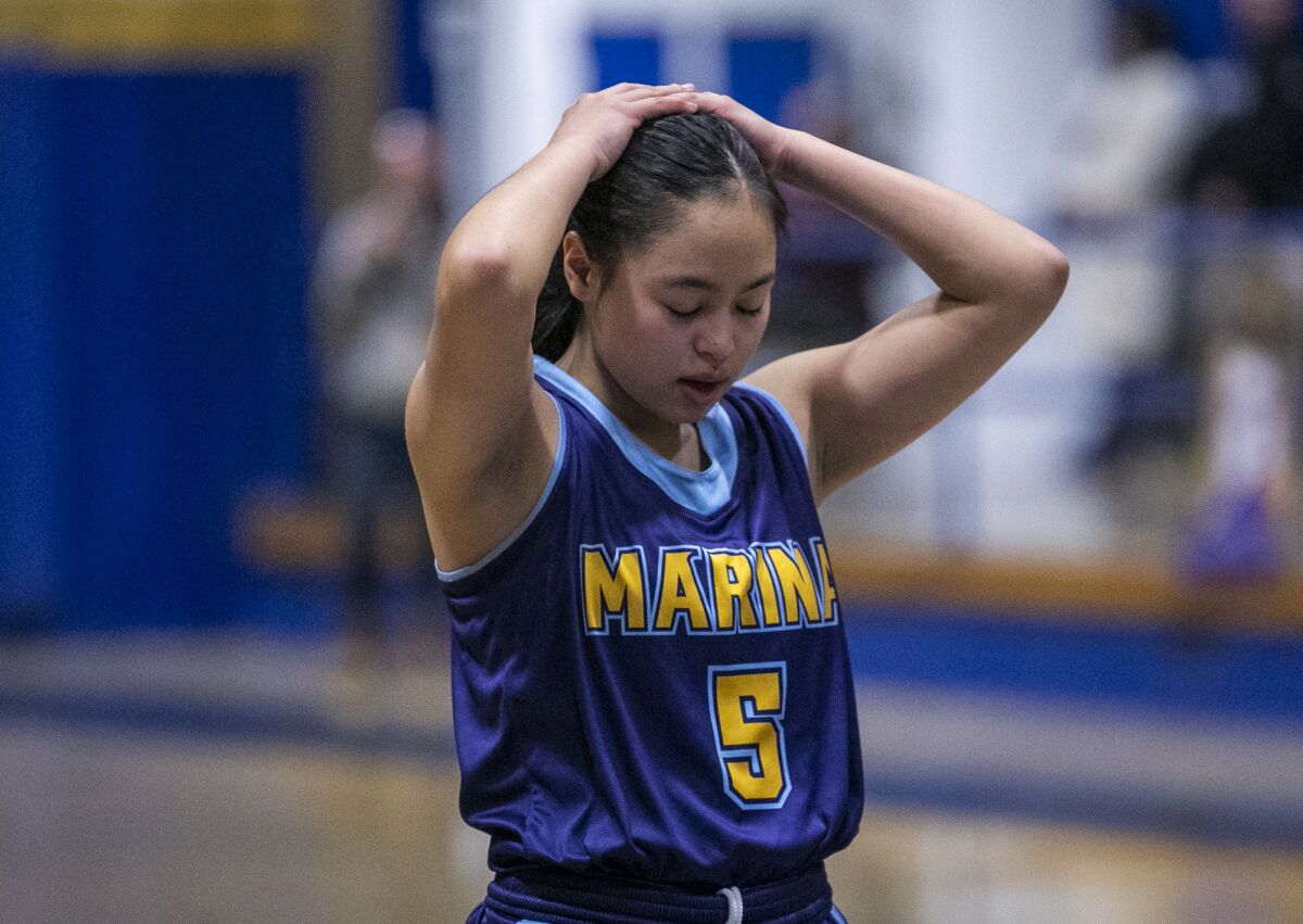 Marina's Kim Nguyen reacts after missing the first of two technical foul shots in the Vikings' semifinal game against Gahr.